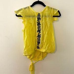 Yellow blouse with blue embroidery